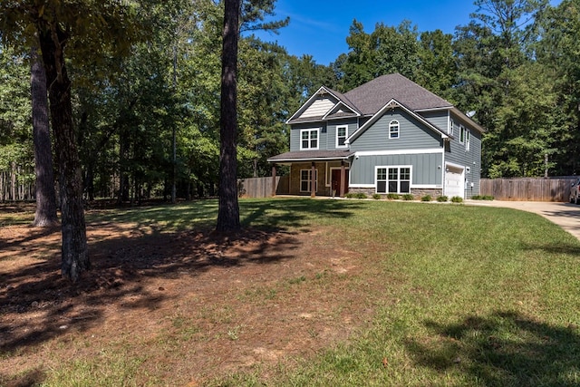 view of front of house with a front lawn and a garage