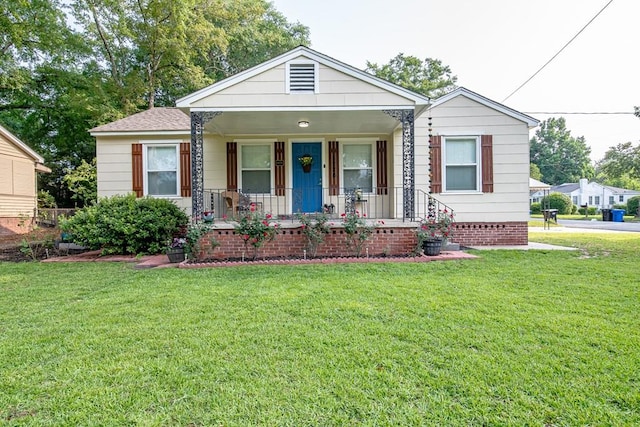 1729 41st St, Columbus, GA 31904 - view of front of house featuring covered porch and a front yard