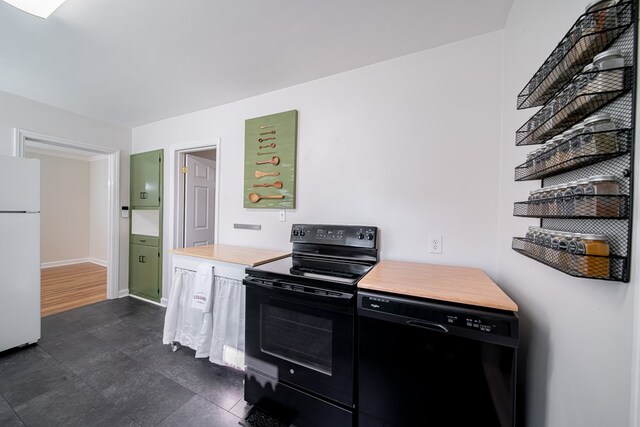 1729 41st St, Columbus, GA 31904 - kitchen with black appliances, baseboards, and dark cabinets