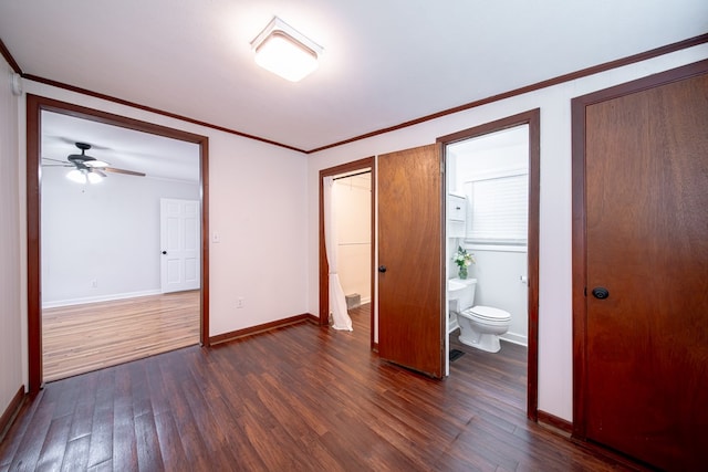1729 41st St, Columbus, GA 31904 - unfurnished bedroom featuring dark wood-style floors, crown molding, baseboards, and ensuite bathroom