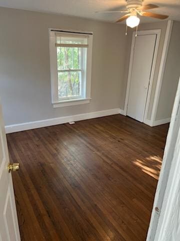 3515 Edgewood Rd, Columbus, GA 31907 - unfurnished bedroom with baseboards, dark wood-style flooring, and ceiling fan