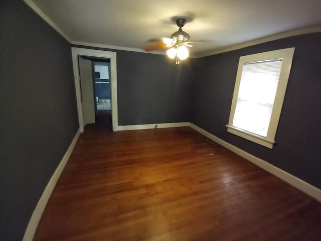 3515 Edgewood Rd, Columbus, GA 31907 - spare room with crown molding, baseboards, dark wood-type flooring, and ceiling fan