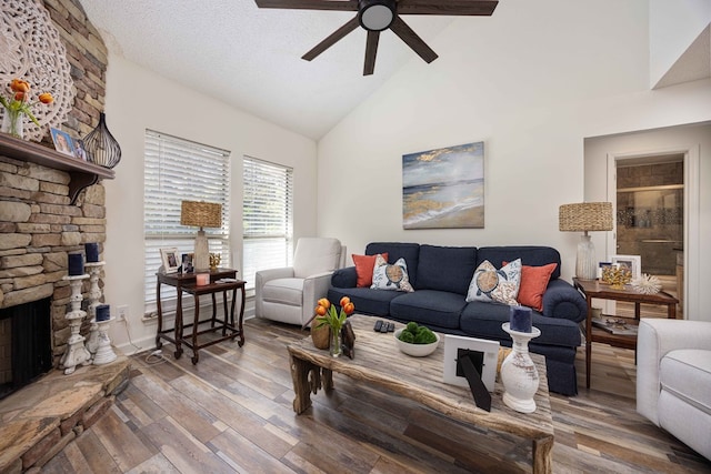 333 Eastside Dr Unit 4, Fortson, GA 31808 - living area with a stone fireplace, a ceiling fan, high vaulted ceiling, and wood finished floors