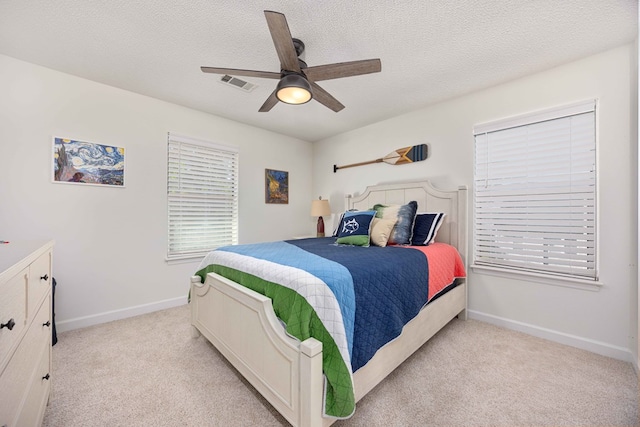 333 Eastside Dr Unit 4, Fortson, GA 31808 - bedroom featuring baseboards, light carpet, a textured ceiling, a ceiling fan, and visible vents