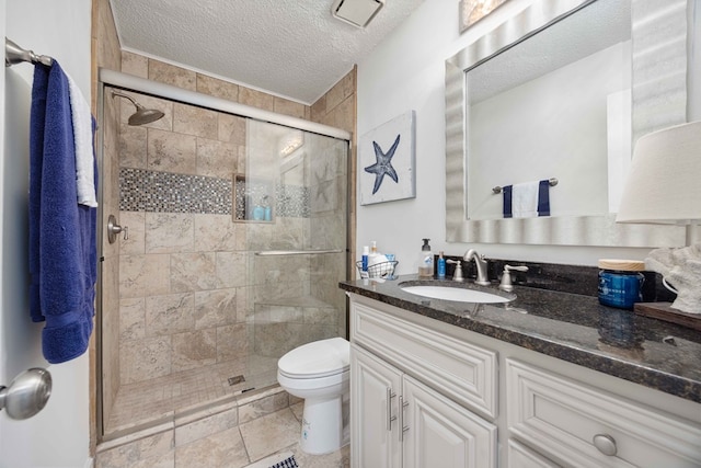 333 Eastside Dr Unit 4, Fortson, GA 31808 - full bath with a shower stall, vanity, a textured ceiling, and toilet