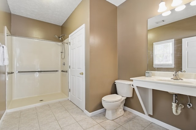 bathroom with walk in shower, baseboards, toilet, tile patterned flooring, and visible vents