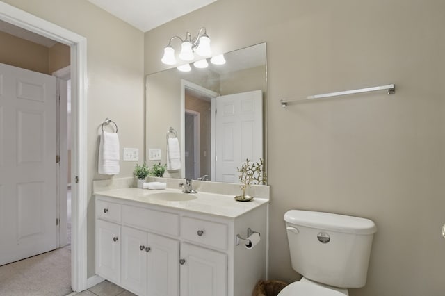 bathroom with toilet and vanity