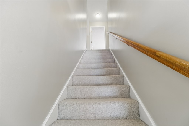 stairway with baseboards