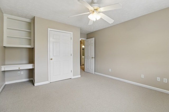 unfurnished bedroom featuring carpet flooring and baseboards