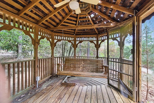 wooden terrace featuring a gazebo