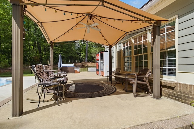 view of patio featuring a pool and a gazebo
