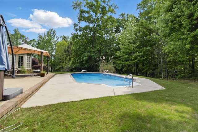 pool featuring a lawn, fence, a patio area, and a diving board