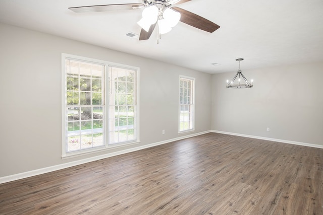 8085 Ga Highway 0219, Hamilton, GA 31811 - unfurnished room featuring wood finished floors, a chandelier, and a ceiling fan