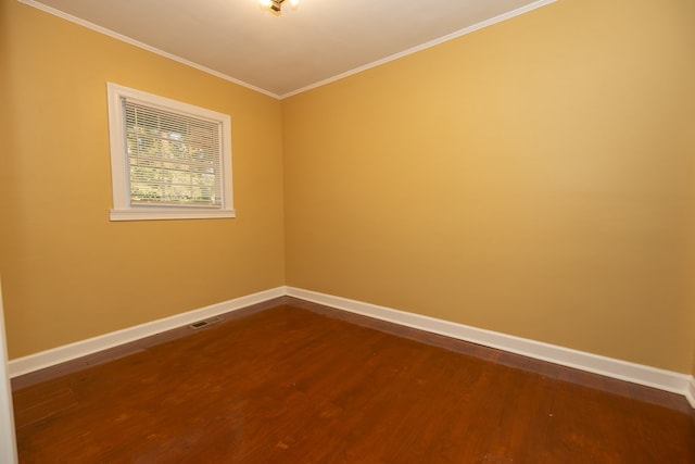 unfurnished room featuring crown molding and wood-type flooring