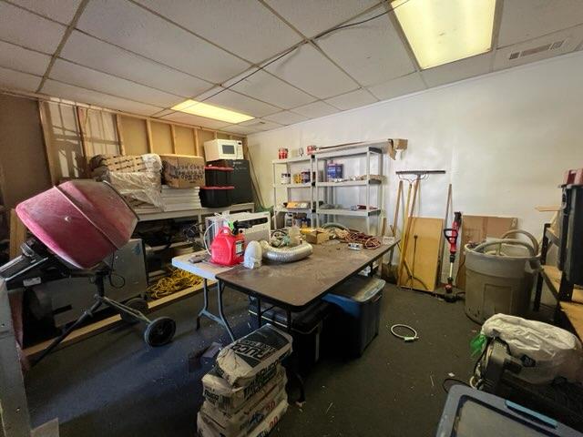 basement featuring a paneled ceiling