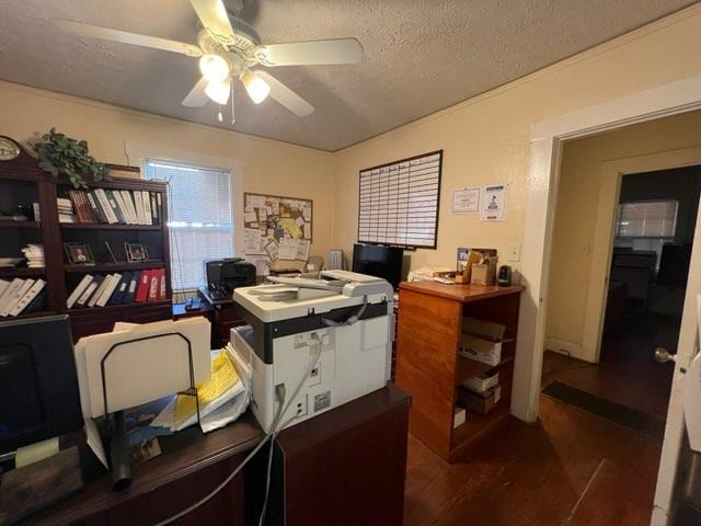 office featuring a textured ceiling, dark hardwood / wood-style floors, and ceiling fan