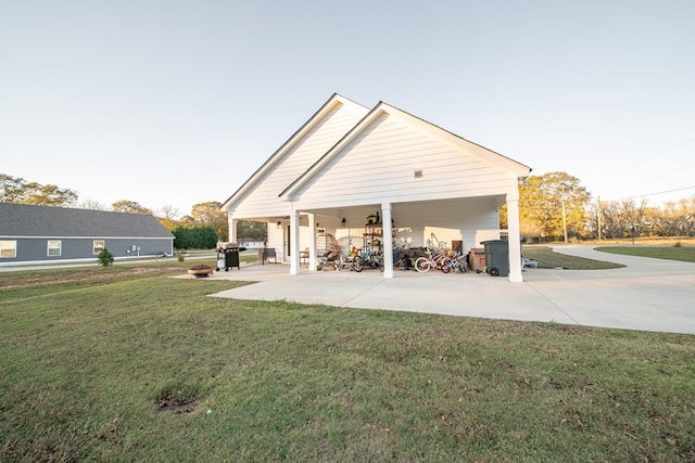 rear view of house featuring a lawn