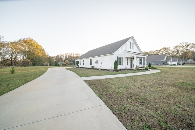 view of property exterior with a yard