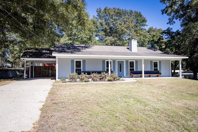 ranch-style house with a carport, an outdoor living space, a porch, and a front yard