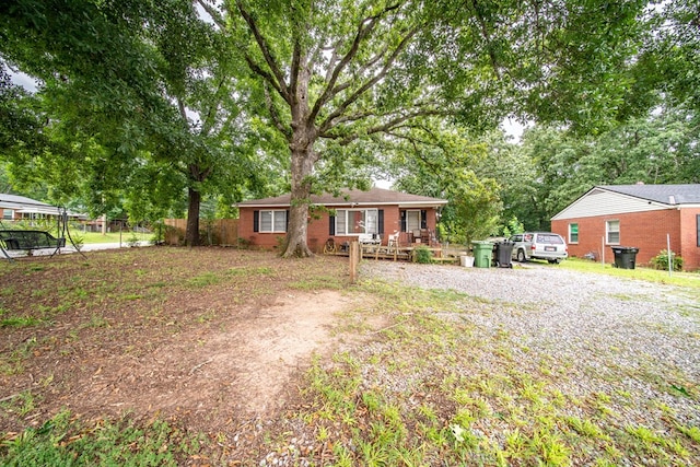 532 48th St, Columbus, GA 31904 - ranch-style house with brick siding and view of wooded area