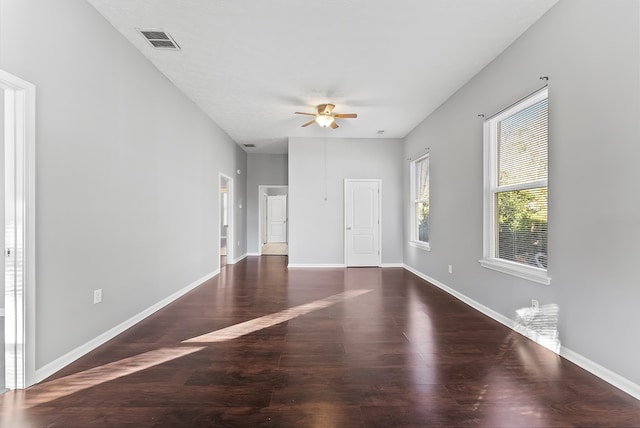 unfurnished room featuring ceiling fan and dark hardwood / wood-style floors