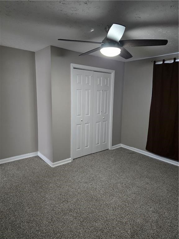 1009 11th St, Phenix City, AL 36867 - unfurnished bedroom with carpet, a ceiling fan, a closet, and a textured ceiling