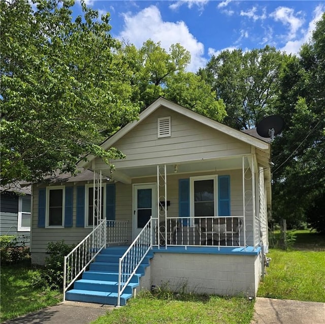 1009 11th St, Phenix City, AL 36867 - bungalow-style house featuring a porch