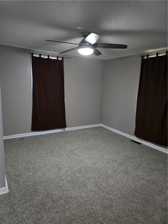 1009 11th St, Phenix City, AL 36867 - unfurnished bedroom with carpet floors and a ceiling fan