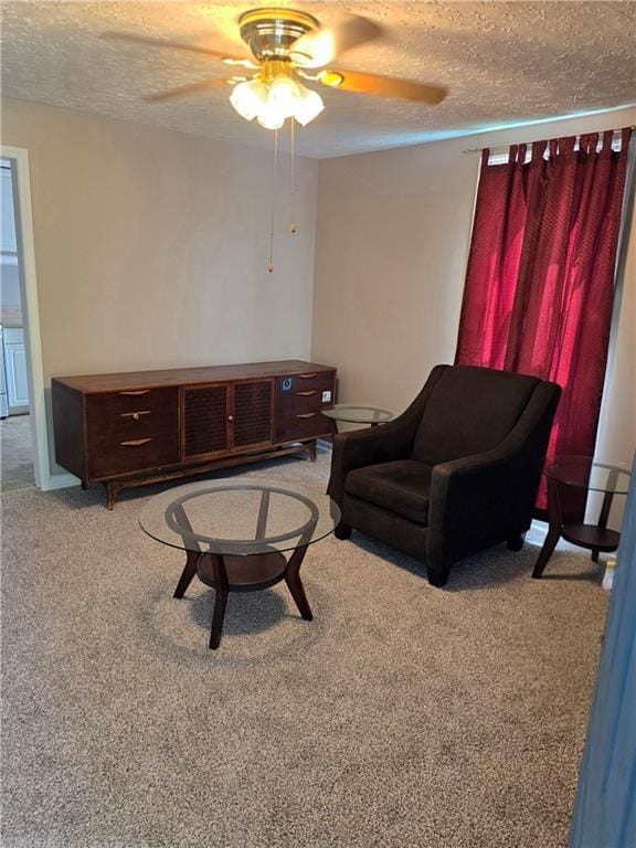 1009 11th St, Phenix City, AL 36867 - living area featuring ceiling fan, a textured ceiling, and light colored carpet