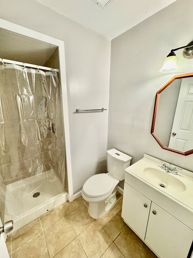 644 Parkwood Dr, Columbus, GA 31907 - full bath with vanity, a tile shower, toilet, tile patterned floors, and a textured ceiling
