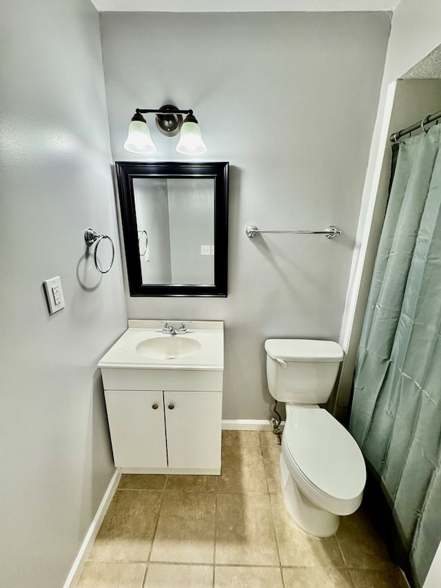 644 Parkwood Dr, Columbus, GA 31907 - full bathroom with baseboards, toilet, vanity, and tile patterned flooring