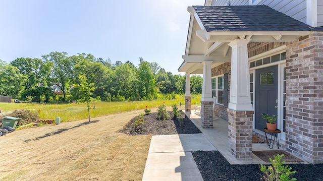 view of yard with covered porch