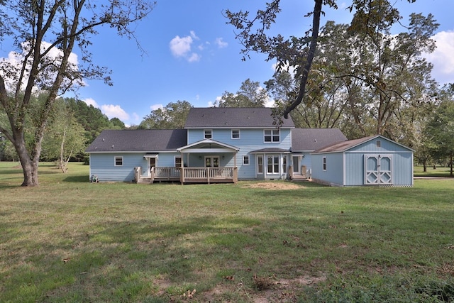 back of property with a shed, a wooden deck, and a lawn