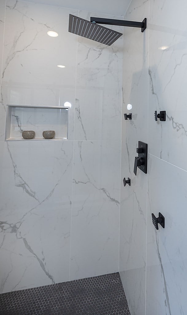 bathroom with tiled shower