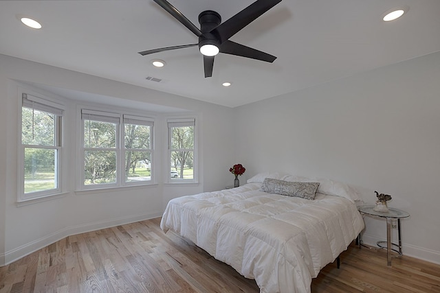 bedroom featuring ceiling fan and light hardwood / wood-style flooring