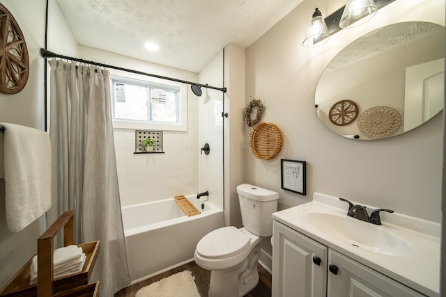 full bathroom with vanity, shower / bathtub combination with curtain, a textured ceiling, and toilet