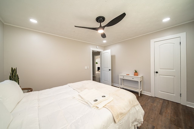 bedroom with ornamental molding, ceiling fan, and dark wood-type flooring