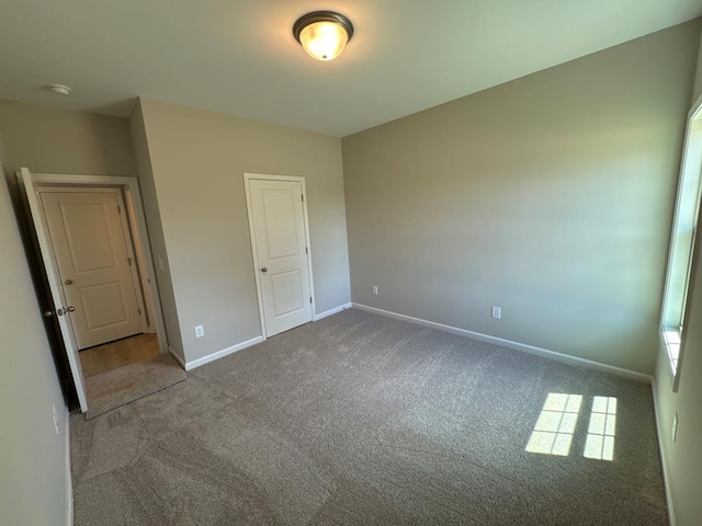 unfurnished bedroom with carpet flooring