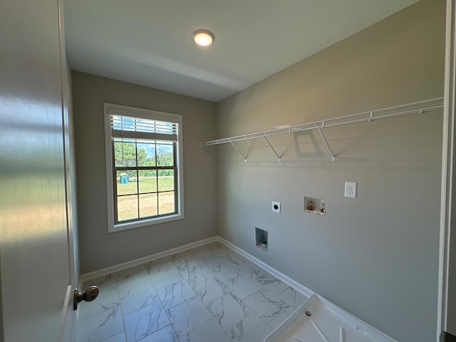 clothes washing area with washer hookup and electric dryer hookup