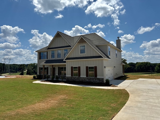 craftsman-style house with a garage and a front lawn