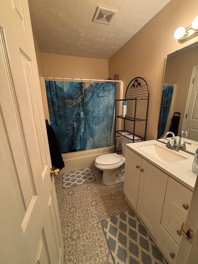 4 Kennedy St, Phenix City, AL 36869 - bathroom with vanity, a textured ceiling, and shower / bath combo with shower curtain