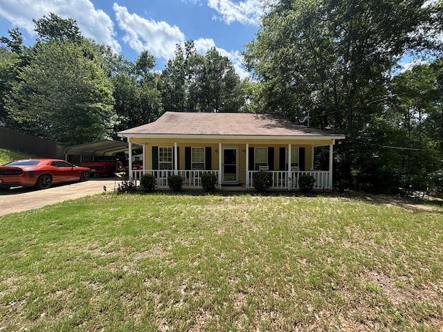 4 Kennedy St, Phenix City, AL 36869 - ranch-style home featuring covered porch, a front lawn, a detached carport, and driveway