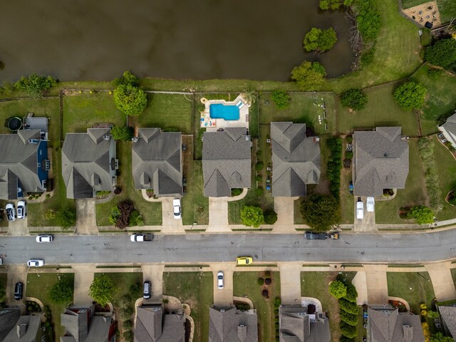 aerial view of property and surrounding area with nearby suburban area