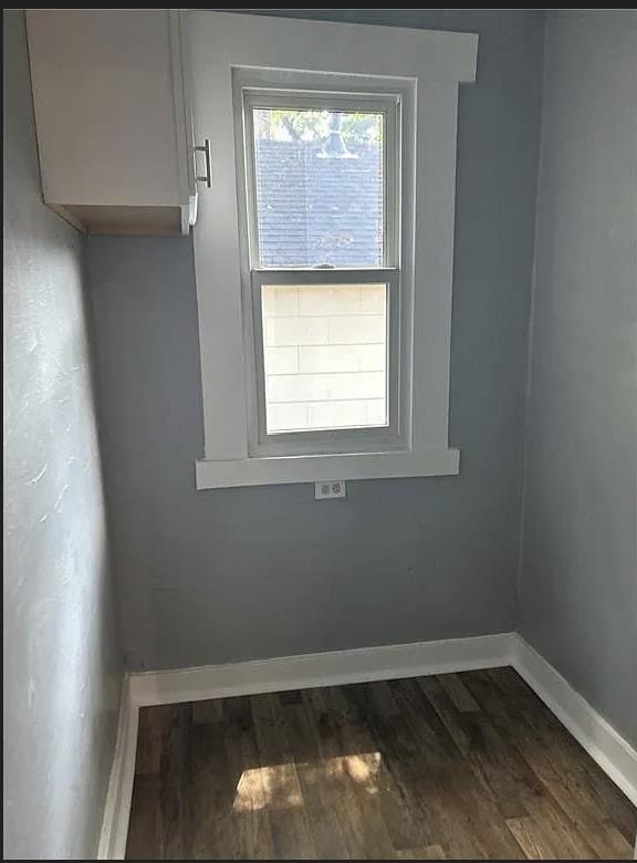2717 Baldwin St, Columbus, GA 31906 - spare room featuring baseboards and dark wood-type flooring