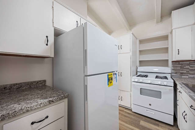 kitchen with white appliances, white cabinetry, tasteful backsplash, and light hardwood / wood-style floors