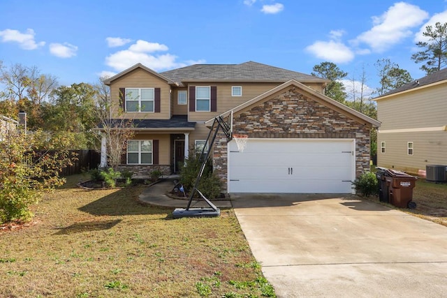 view of front of home with a front yard, a garage, and cooling unit