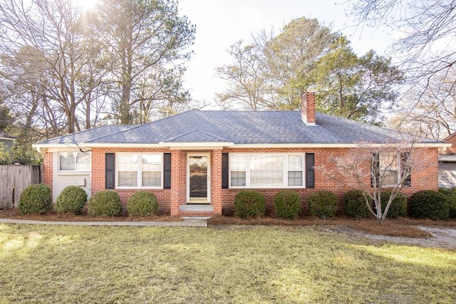 ranch-style house with a front lawn