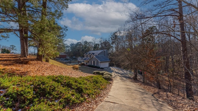 exterior space featuring concrete driveway