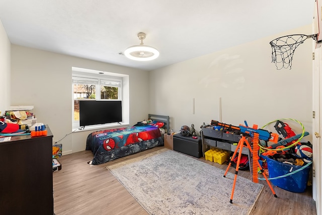 bedroom featuring light wood finished floors