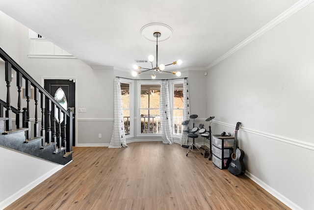 office area with light wood-style floors, baseboards, and an inviting chandelier